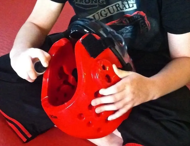 using spray to disinfect sparring helmet