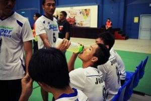 volleyball player drinking sports drink