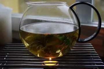 tea brewing in clear pot