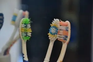 three tooth brushes