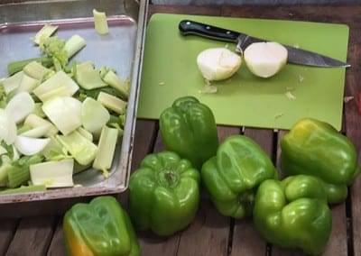 chopped onion next to bell peppers