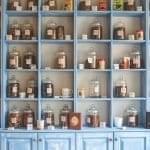 Apothecary shelf of jars of herbs